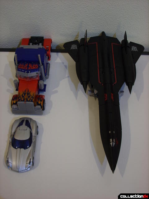 RotF Leader-class Autobot Jetfire (R), Optimus Prime (L, back), and Deluxe-class Sideswipe (L, front) vehicle modes