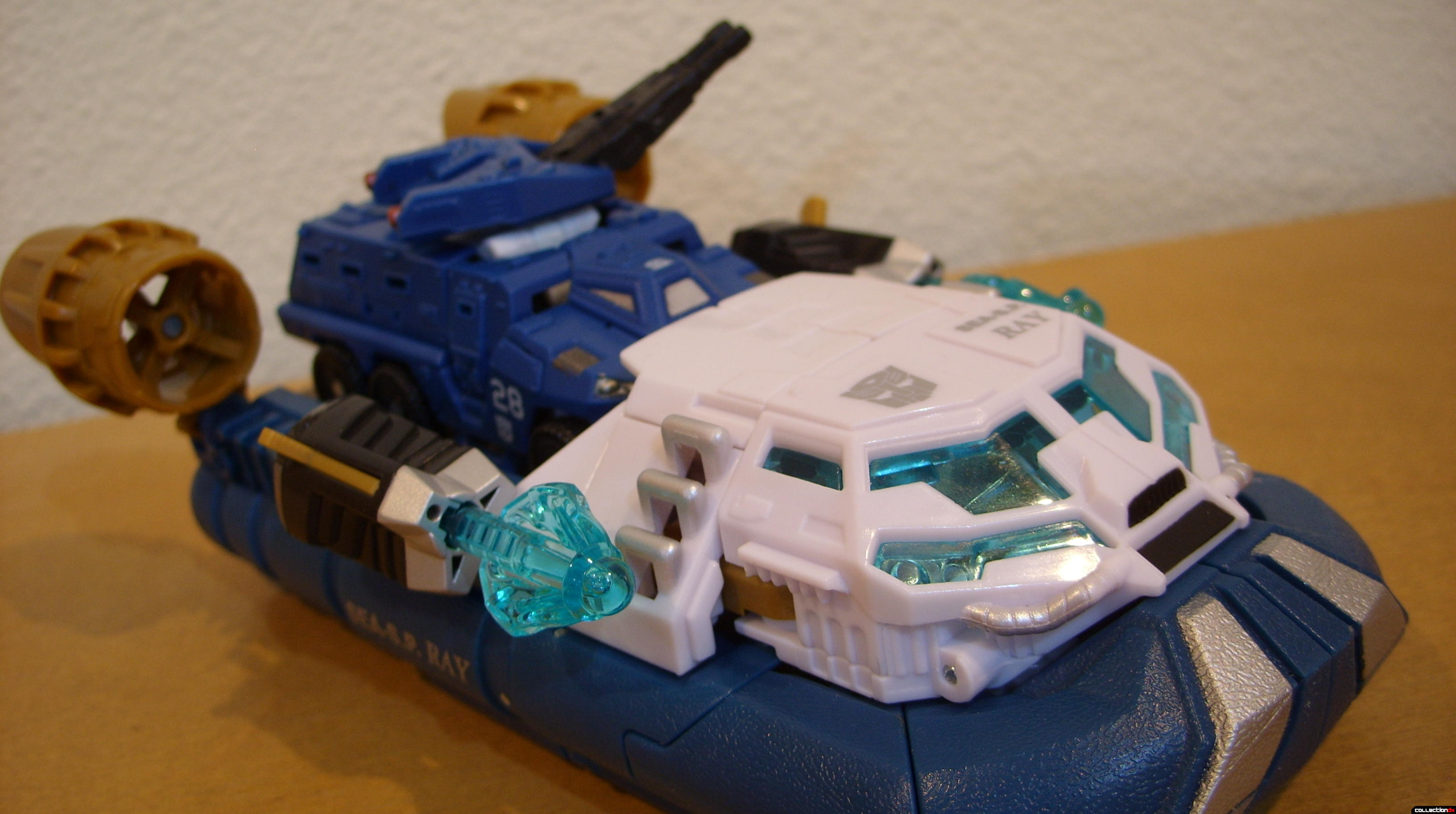 Voyager-class Autobot Sea Spray- vehicle mode dramatic angle (with Scout-class Autobot Breacher)