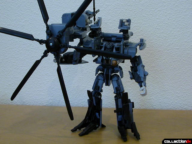 Decepticon Blackout- robot mode (with rotor weapon attached)